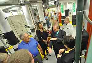 Jack Burns leads a tour of the new geothermal system following the ribbon cutting