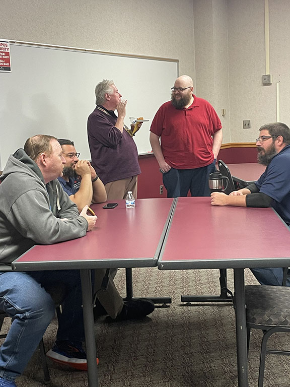 Employees conversating at table