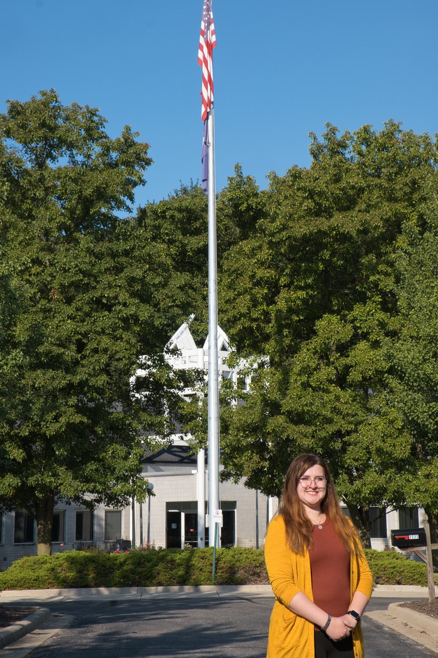 Rebecca Fournier poses in front of Whitman Center