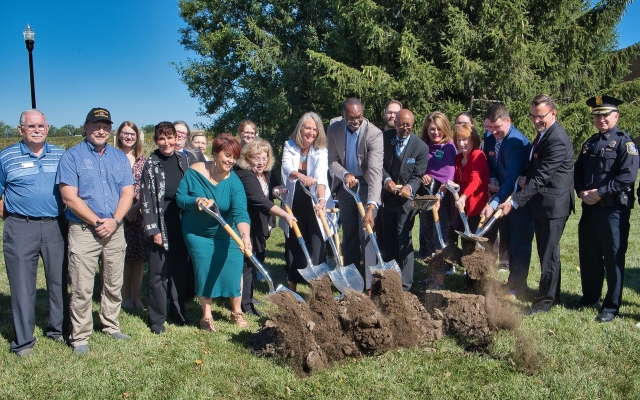 Group of politicians and employees breaking ground in front of Welch Building