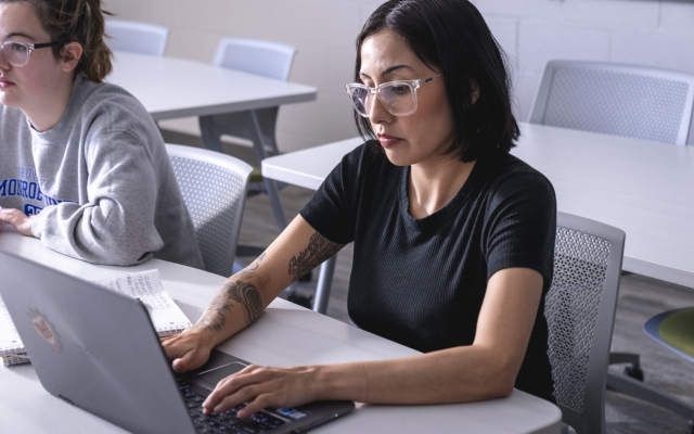 Student at computer in class